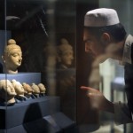 An Afghan student looks at a display of ©AFP/Getty Images