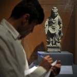 An Afghan records details of a Buddha st ©AFP/Getty Images